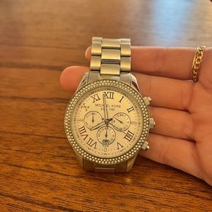 Silver Michael Kors watch with diamond-studded face rim